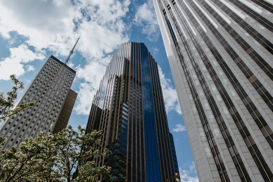 Low angle view of modern commercial office buildings representing commercial property tax assessments and appeals.